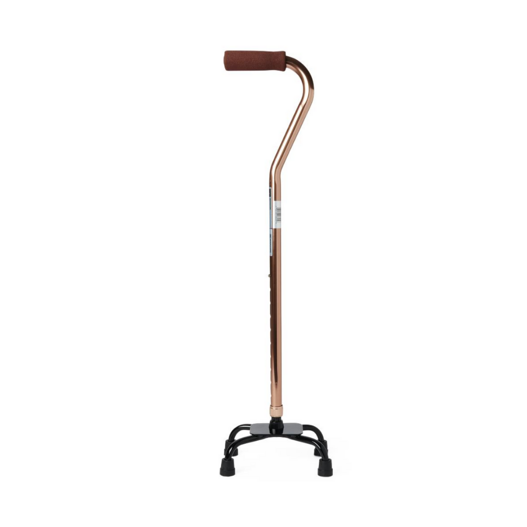 The Medline Quad Canes with Small Base features a bronze color, brown foam handle, black base, and four skid-resistant rubber tips for stable support with walking and balance.